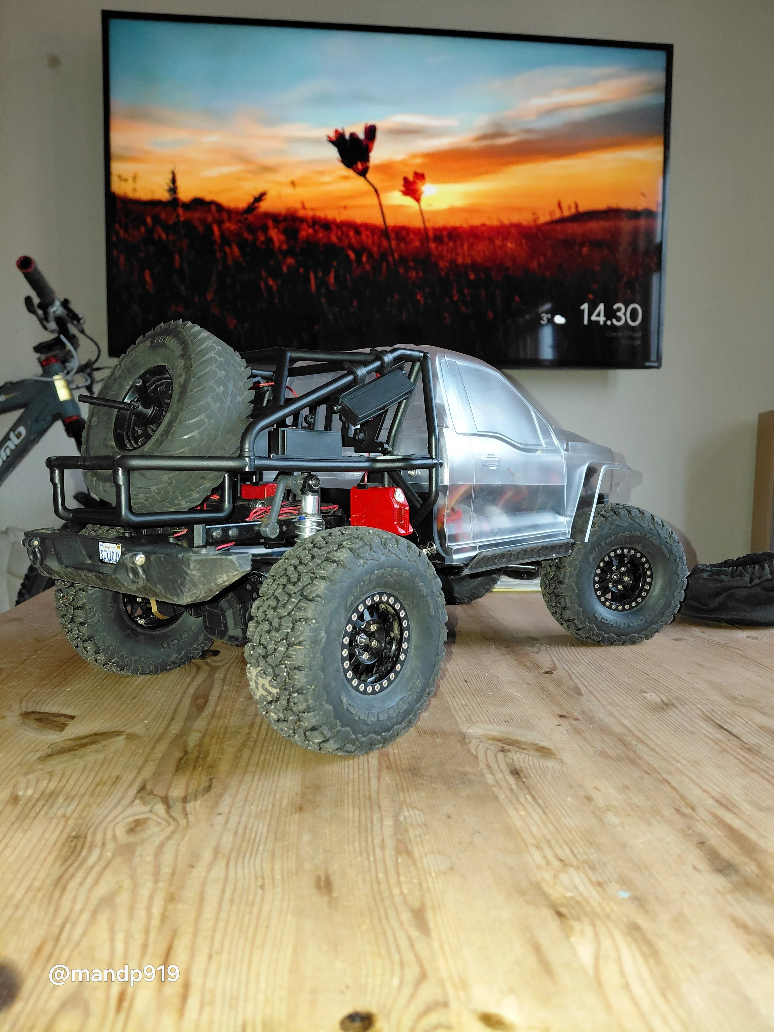 Element rc crawler on a table with a tv in the background