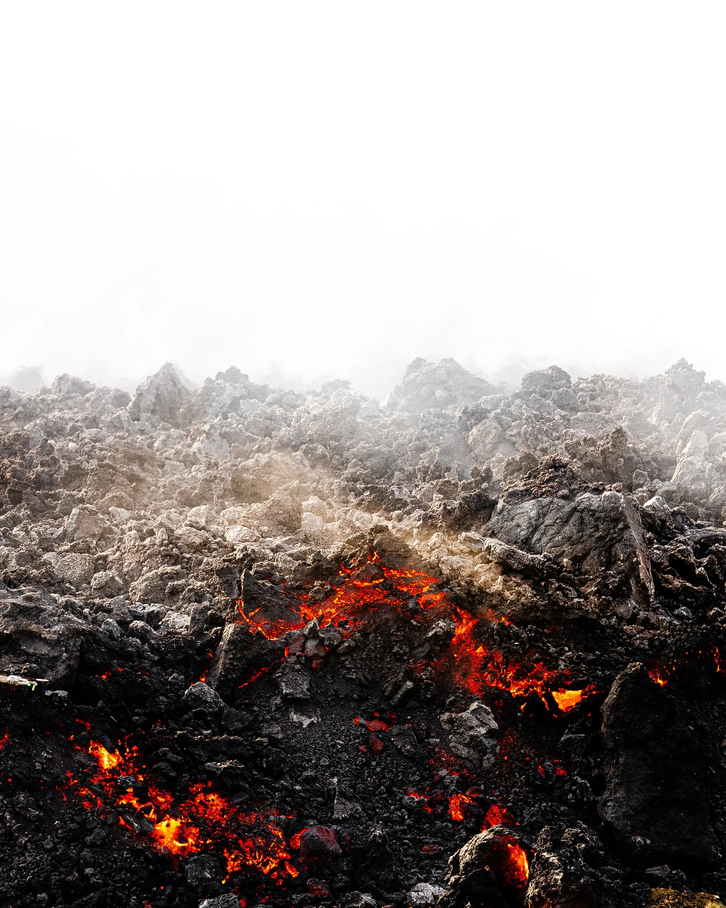 Lava rocks with glowing red lava and steam rising in the background.