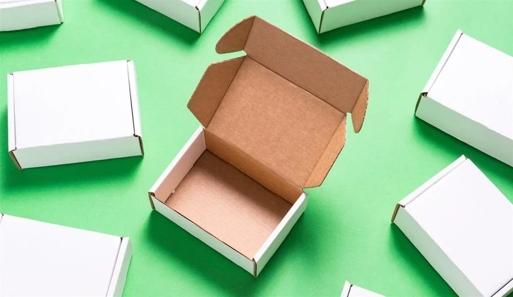 Sustainable cardboard boxes and eco-friendly packaging materials stacked together