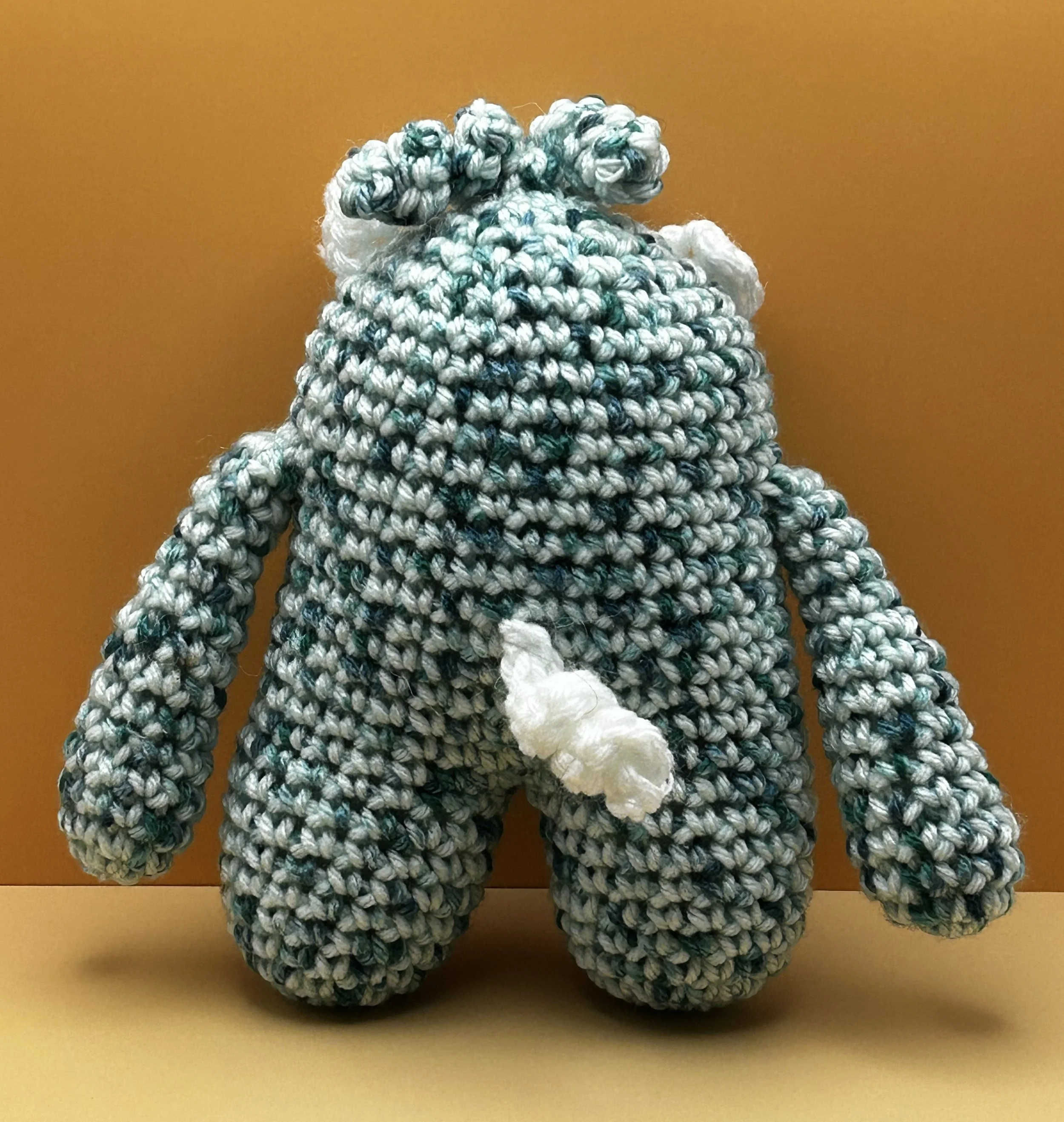 Sprout back of green and white monster with curly white tail