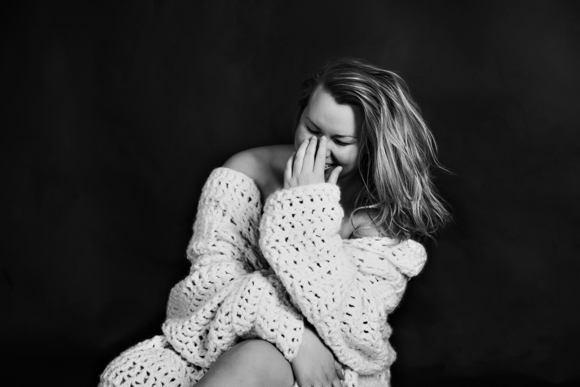 Joyful authentic portrait of a woman laughing in a chunky knit wrap, The Raw Project, Boudoir by Emily, Beaufort SC