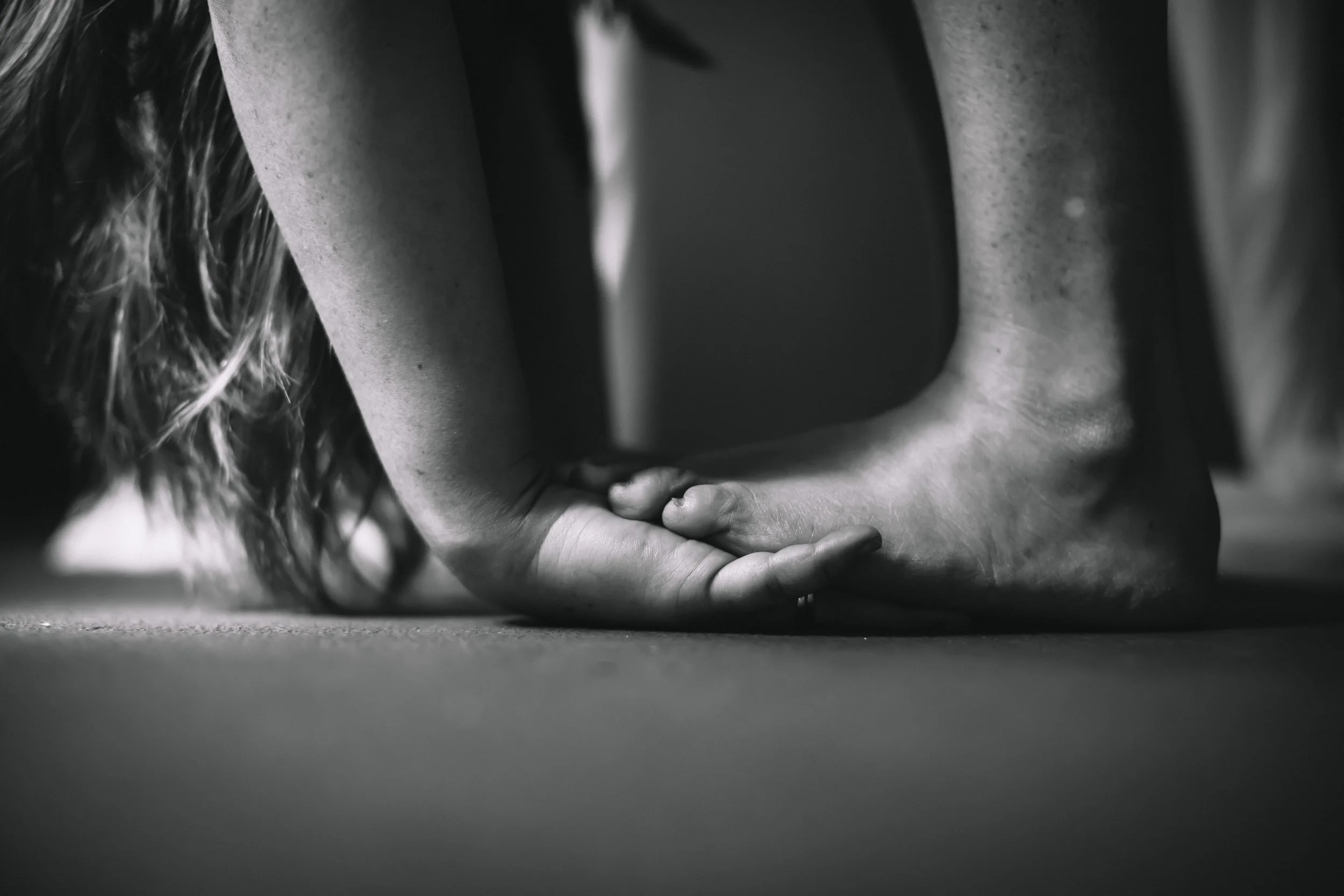 Abstract black and white fine art detail portrait of hands and feet, artistic photography by Emily Scott, Lowcountry SC