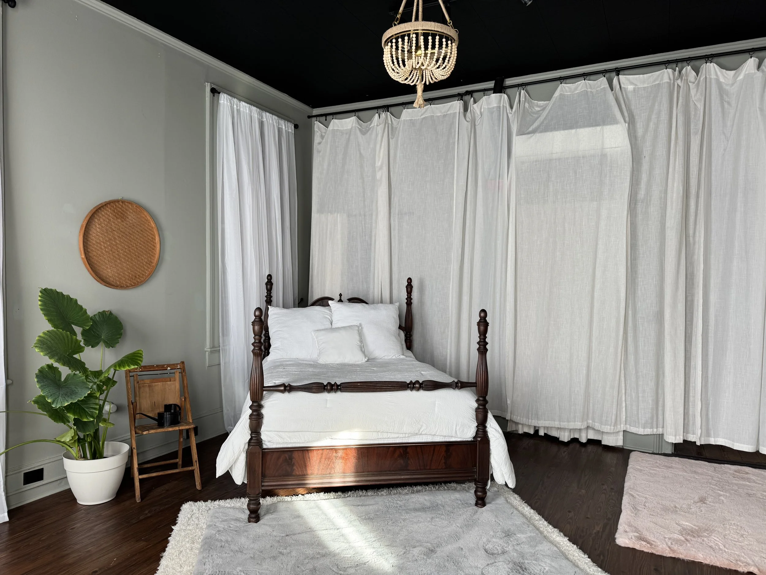 Bay Street Studios boudoir photography studio with four-poster bed and crystal chandelier, downtown Beaufort SC