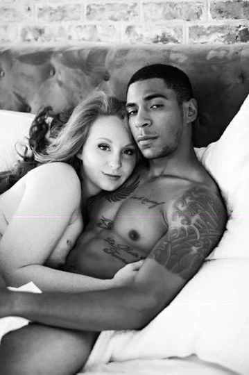 Intimate black and white close-up couples boudoir portrait of two partners resting together in bed, Bay Street Studios