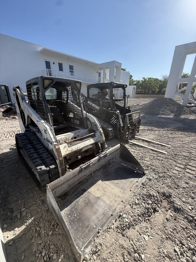 Skid steer on a Palm Beach County jobsite