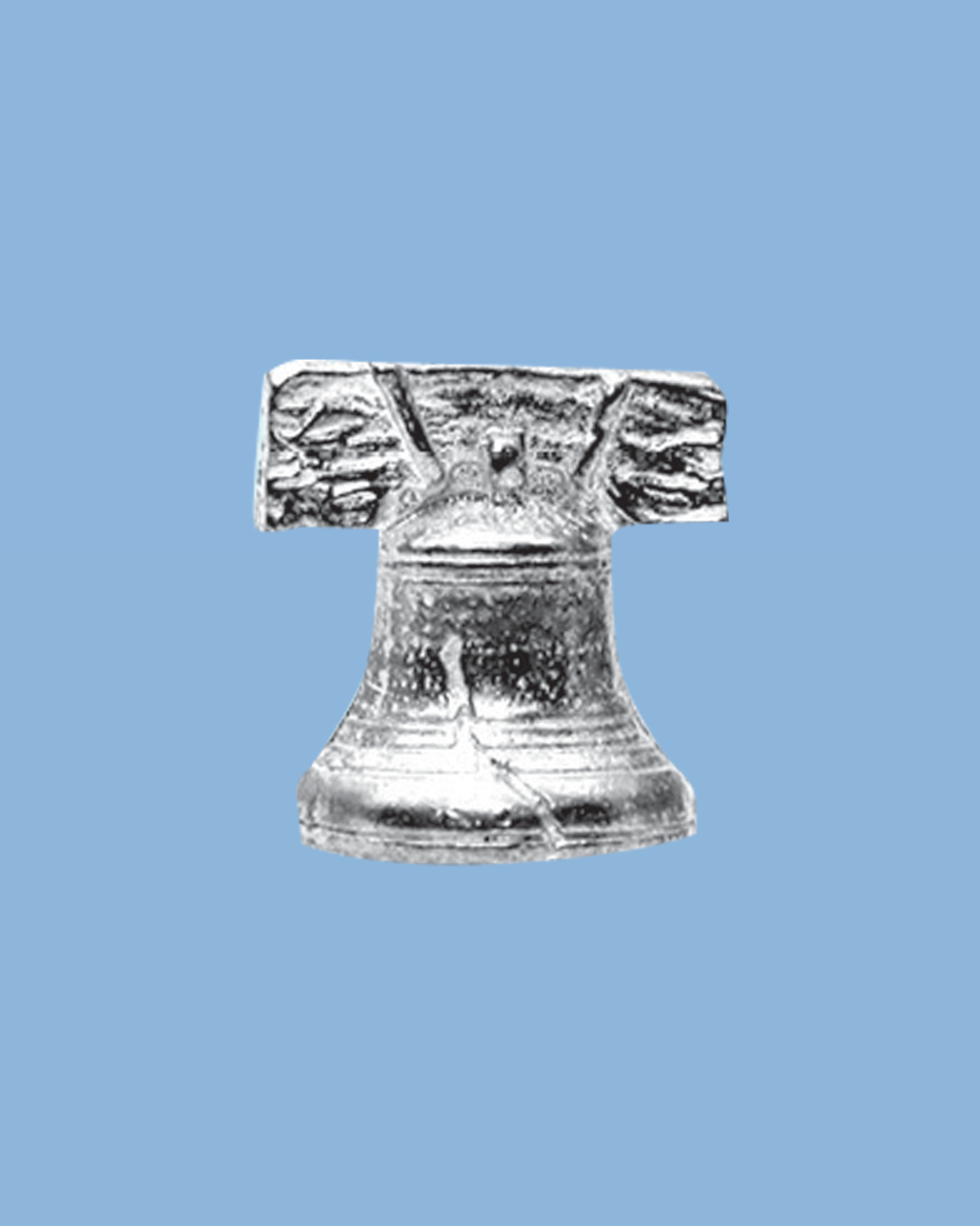 A silver-colored carved figure of a human-like face with prominent brows, eyes, and a broad nose against a light blue background.