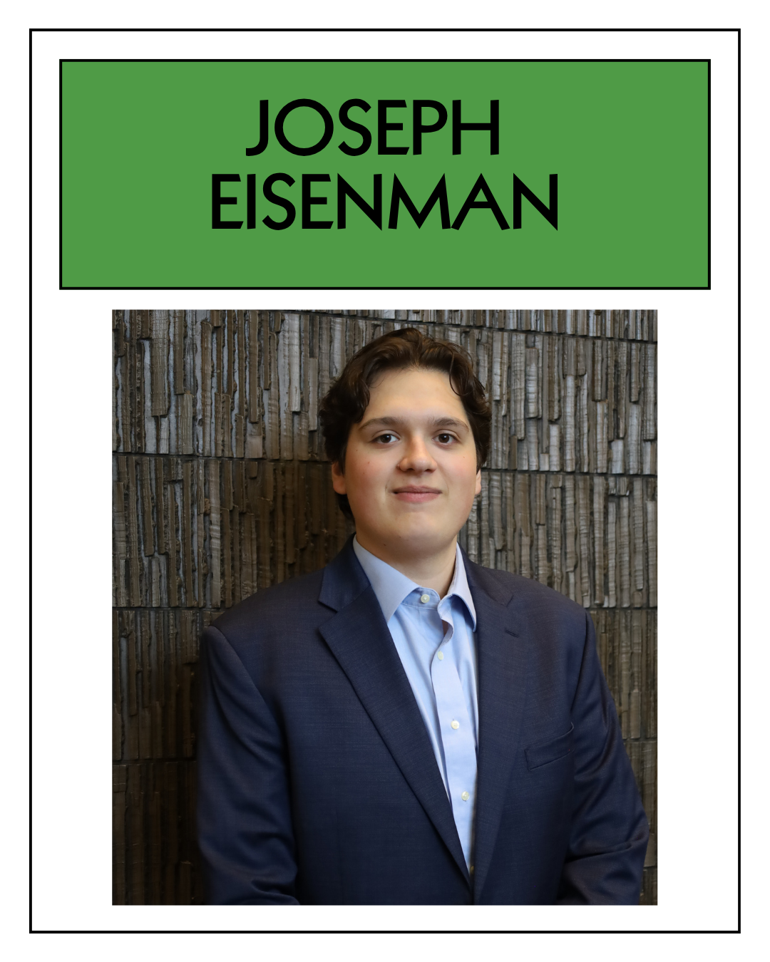 Portrait of a young man in a business suit standing in front of a textured wall, with a green sign above displaying the name 'Joseph Eisenman' in black letters.