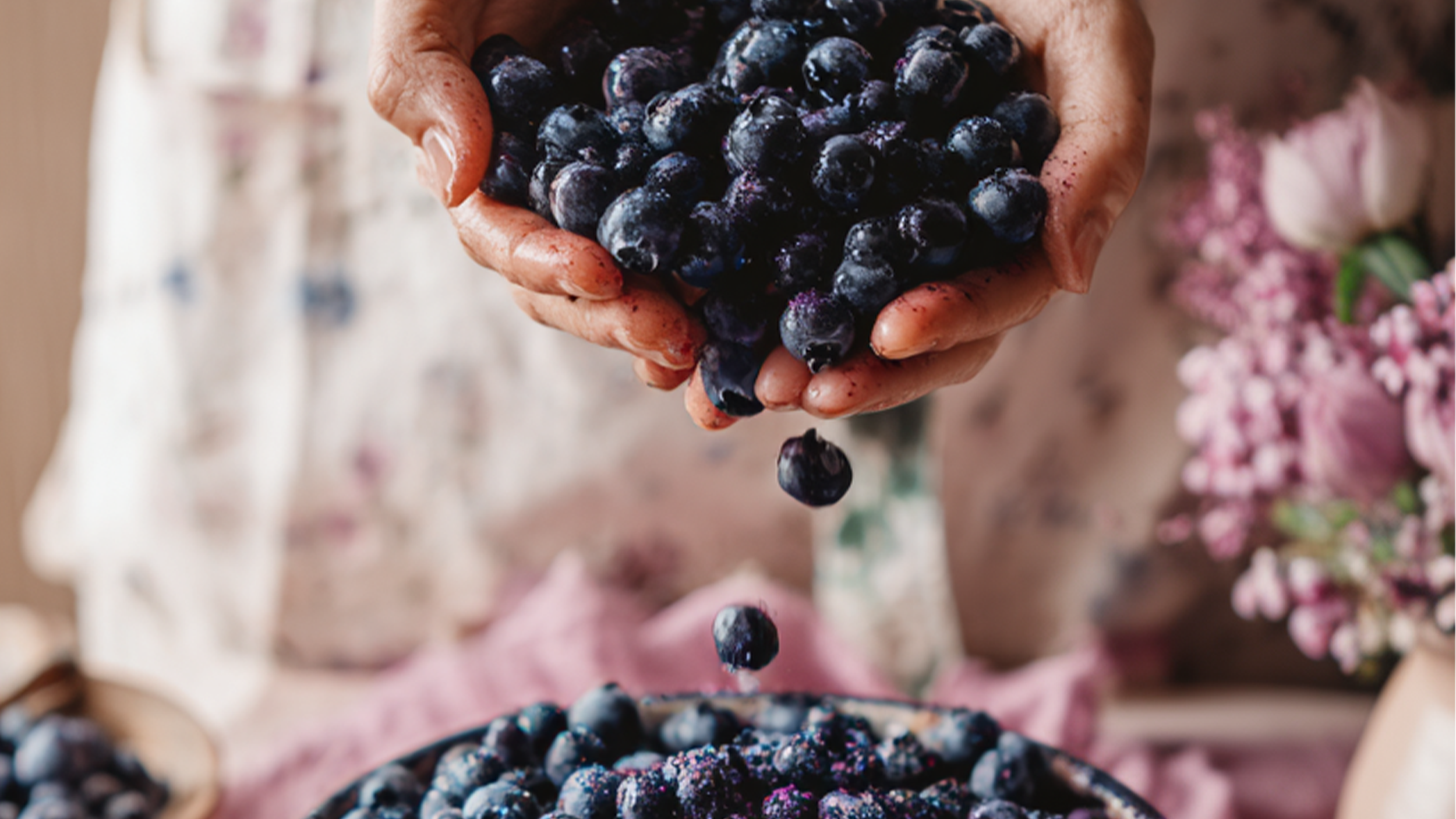Fresh blueberries in a bowl being tossed with cane sugar