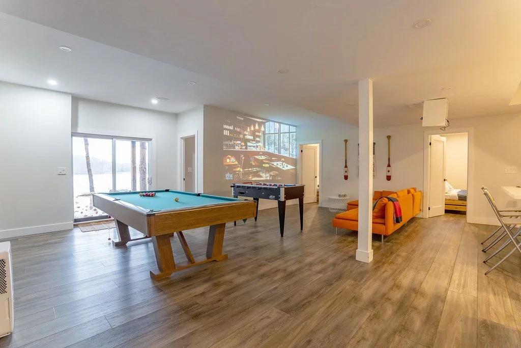 Lower level living room with walk out to the patio and stairs to the beach and the lake