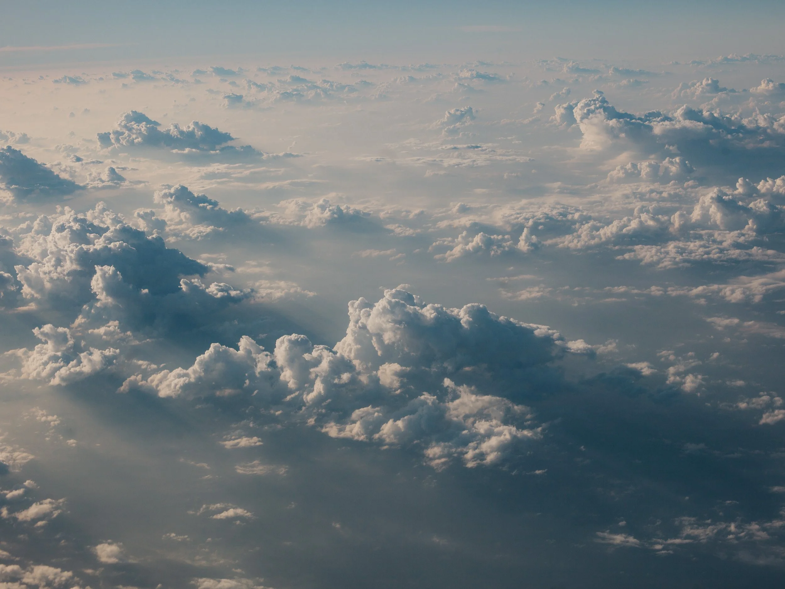 Clouds seen from above in the sky.