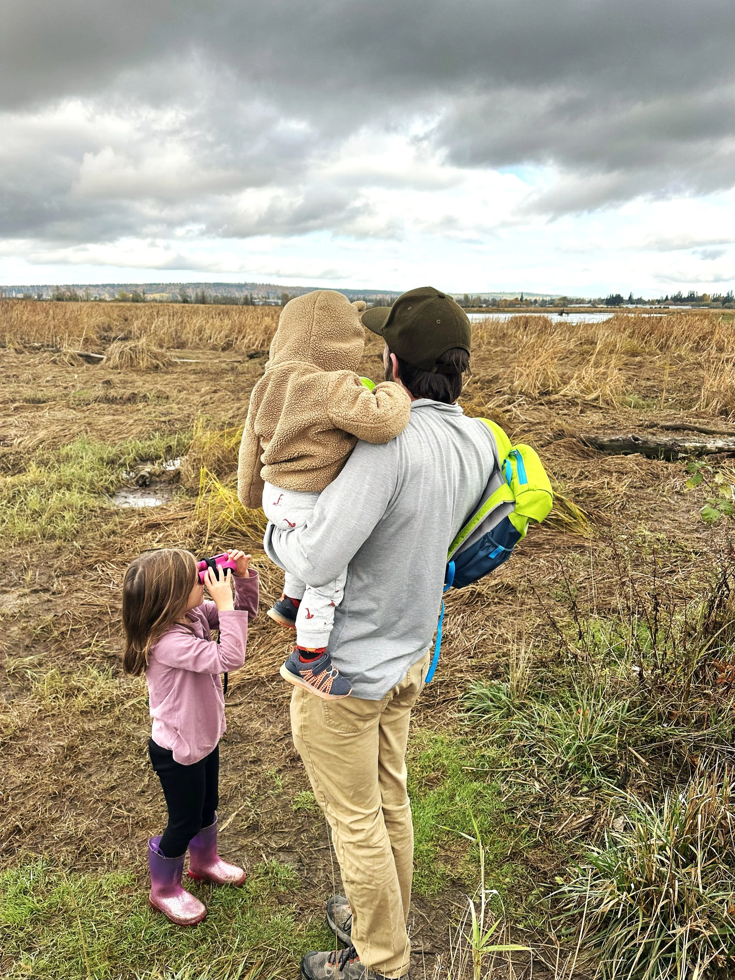Sunnyside Member Matt and his children looking out over the waterfront