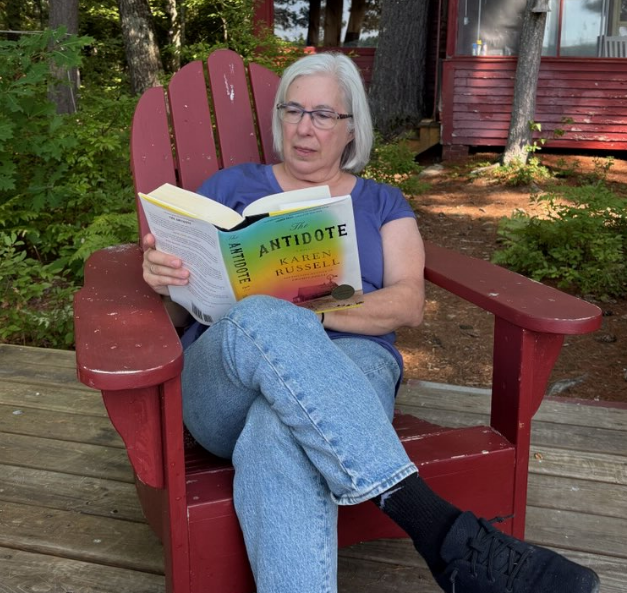 Pm relaxing with book.png