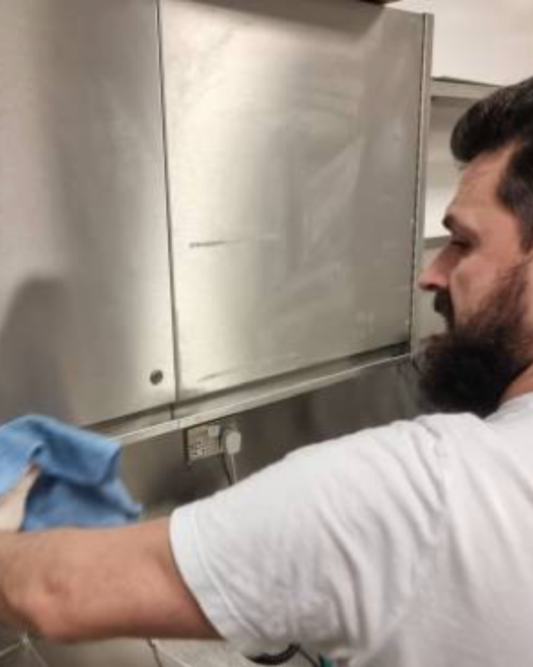 Commercial kitchen deep cleaning service thoroughly sanitising surfaces and equipment.