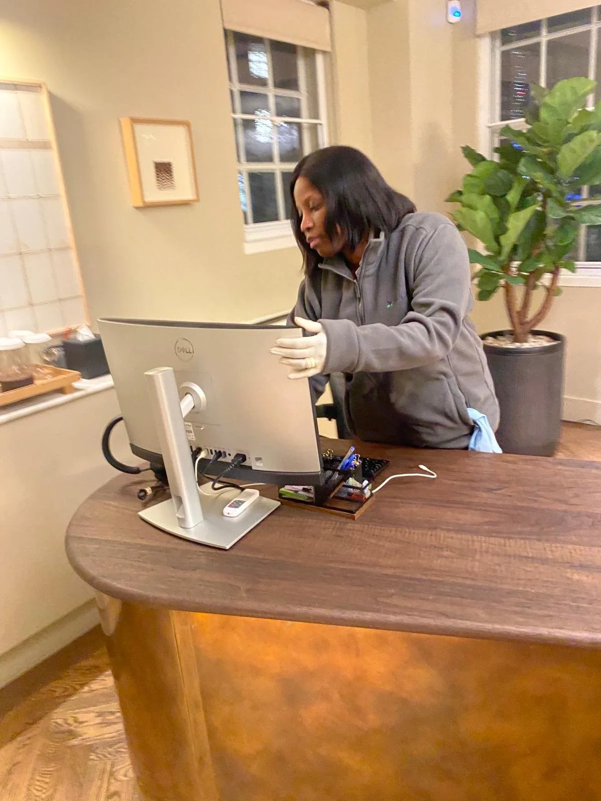 Professional cleaning of IT equipment in modern office workspace