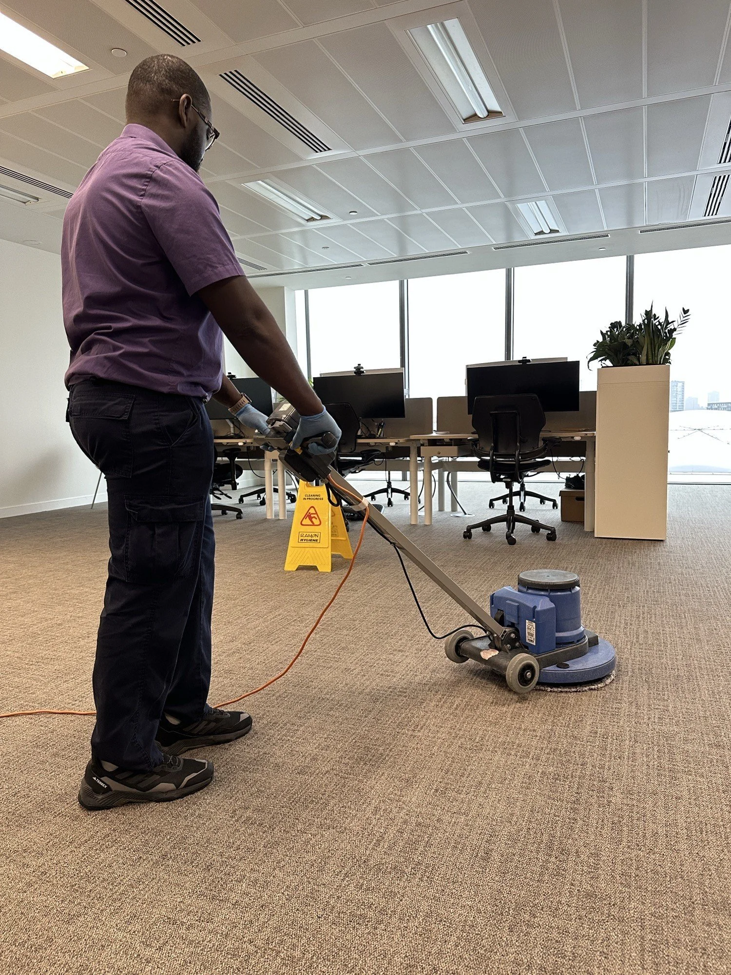 arpet cleaner extracting dirt from office carpet in business workspace