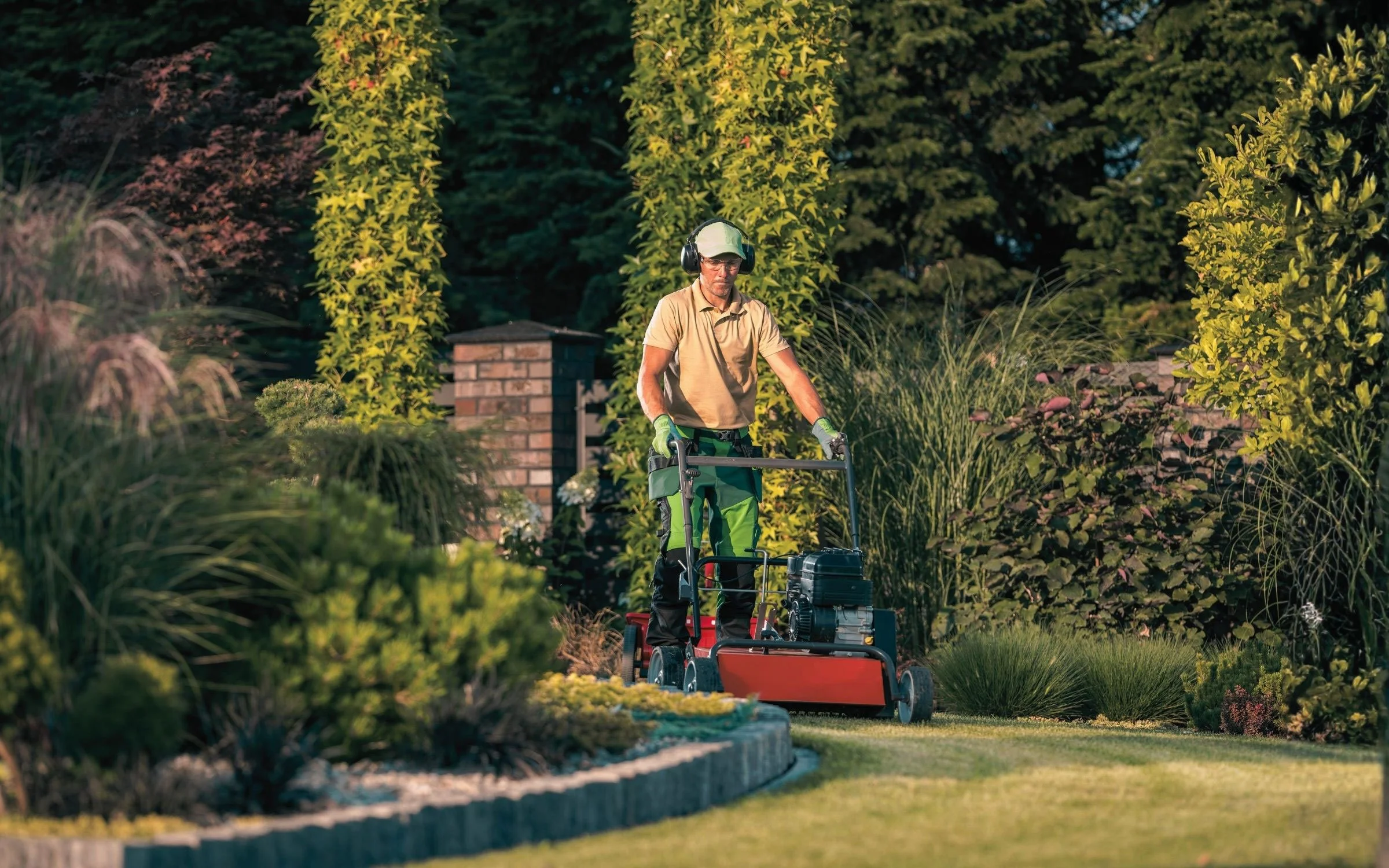 stoneway-strategic-man-mowing-landscaped-yard.jpg