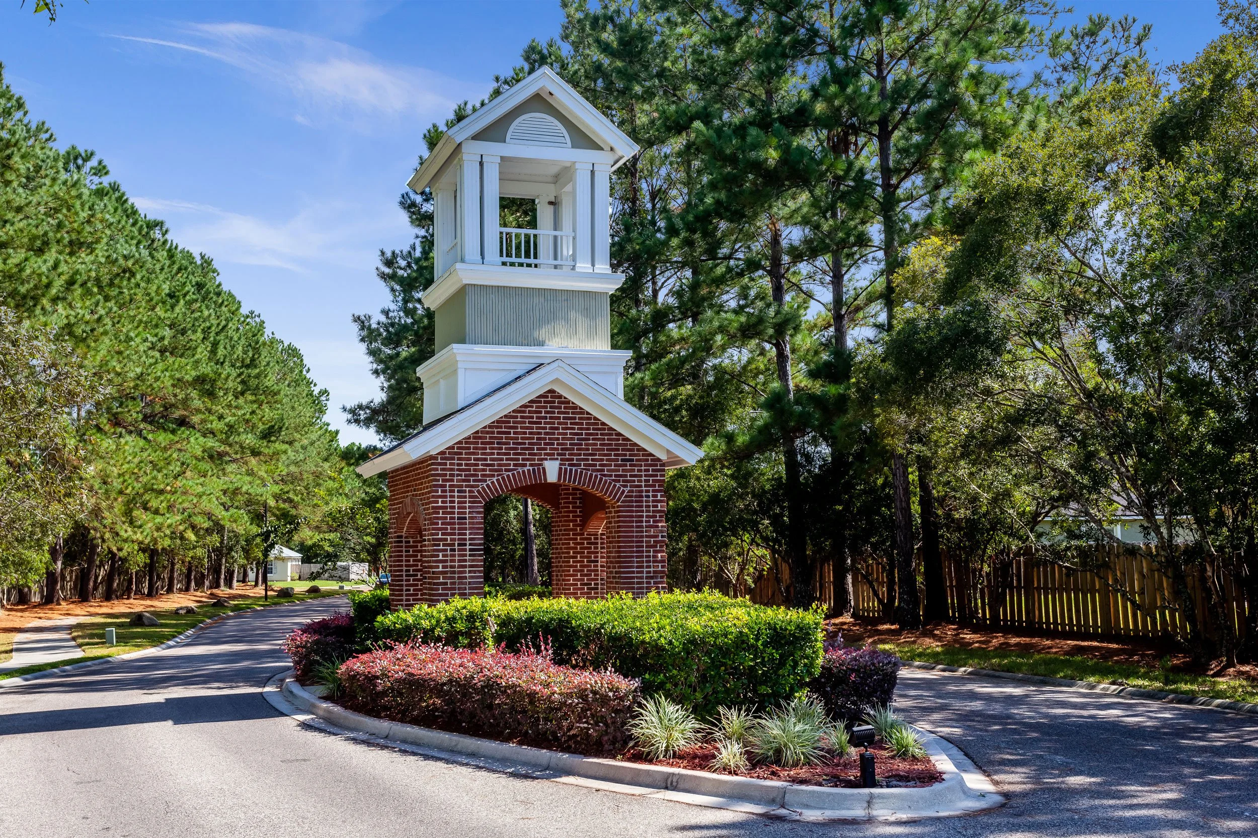 stoneway-strategic-neighborhood-entryway-with-blue-sky-and-tall-green.jpg