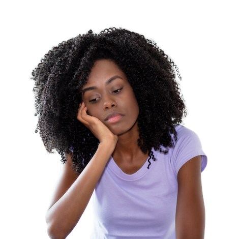 A young woman with curly black hair resting her head on her hand, looking down with a pensive expression, wearing a light purple T-shirt.