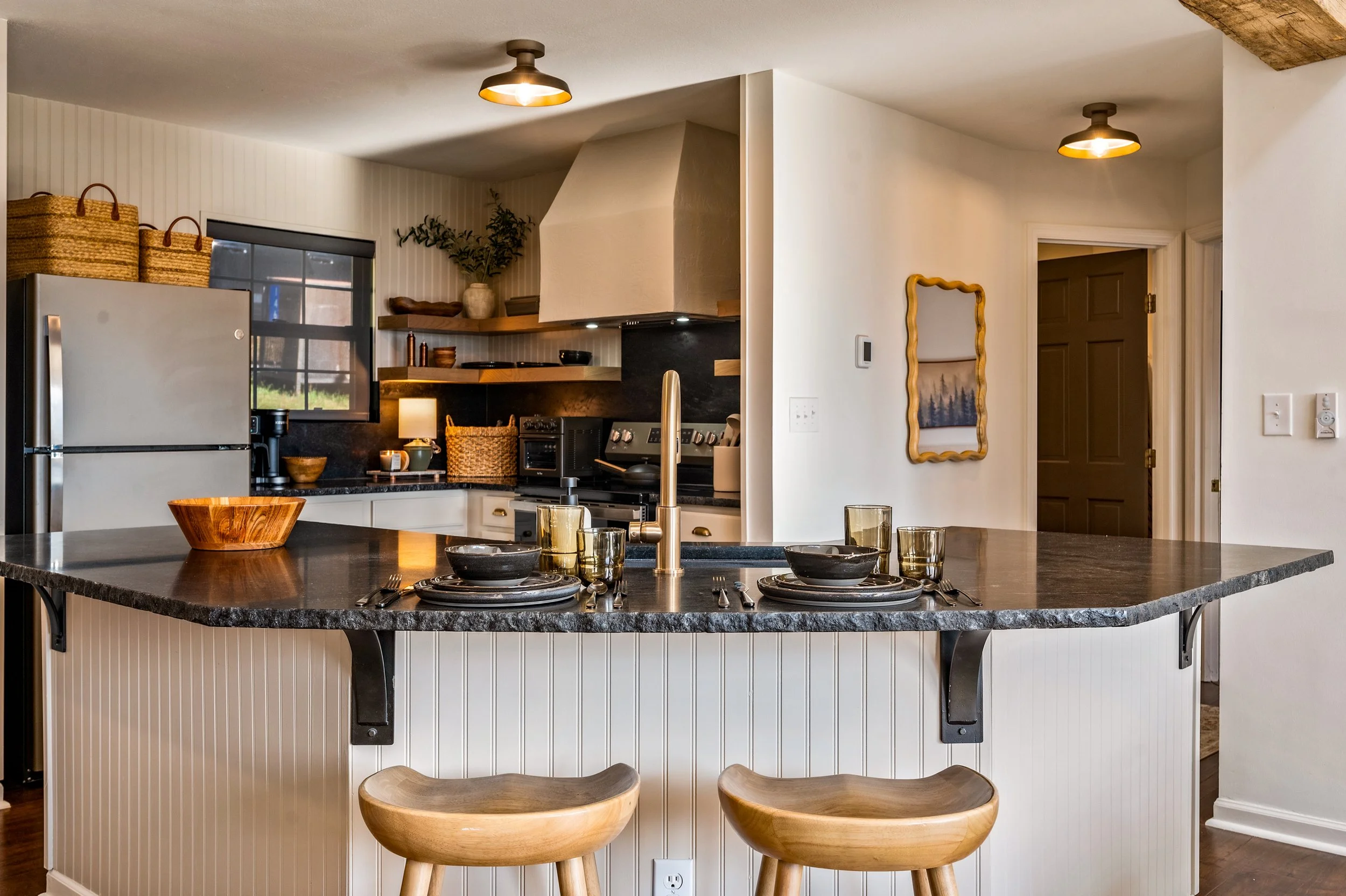 A cozy, cabin-style kitchen with rich wood tones and timeless charm—fully equipped for your culinary moments.