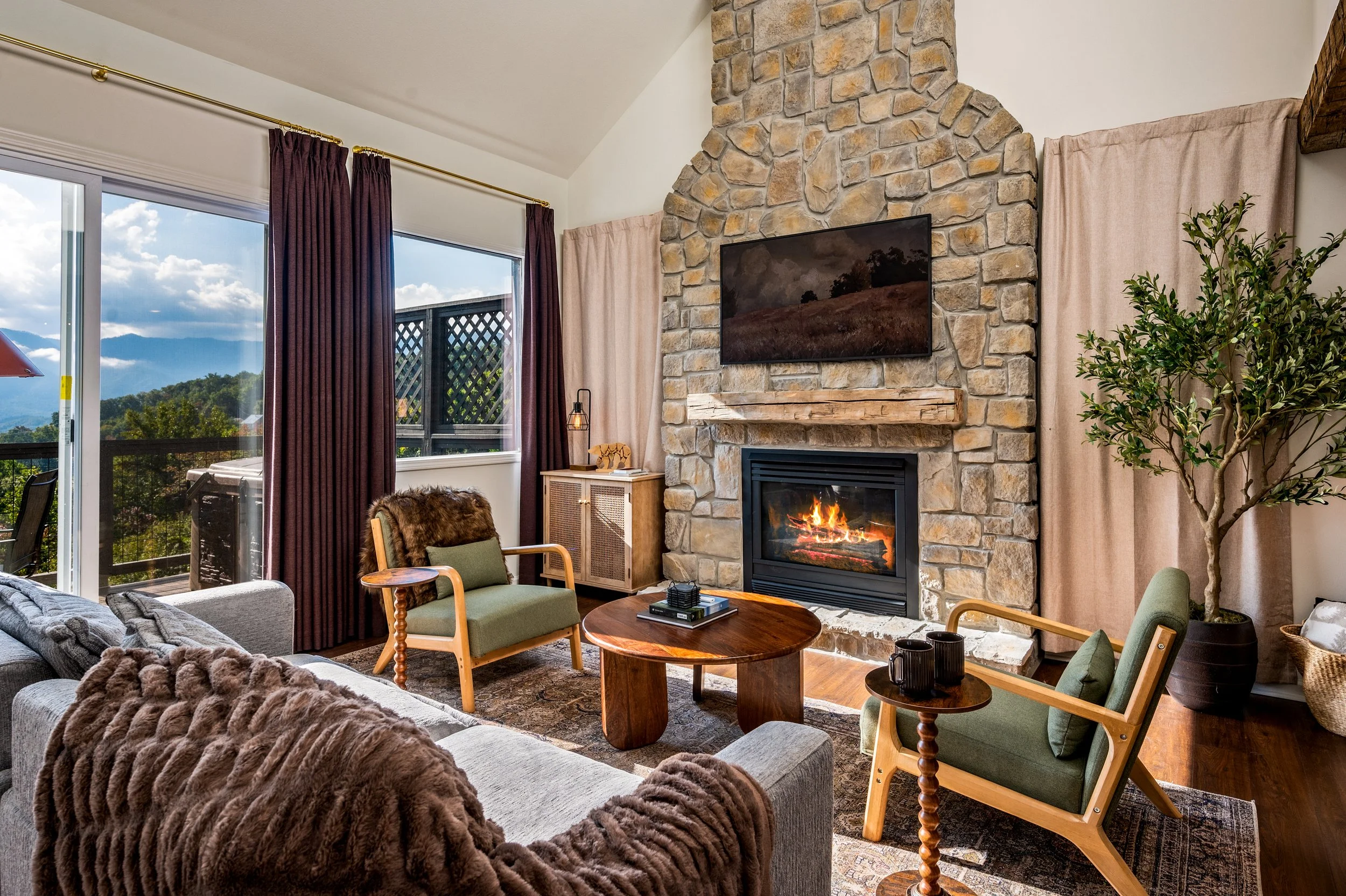 Curl up by the grand stone fireplace in this inviting living space designed for connection.