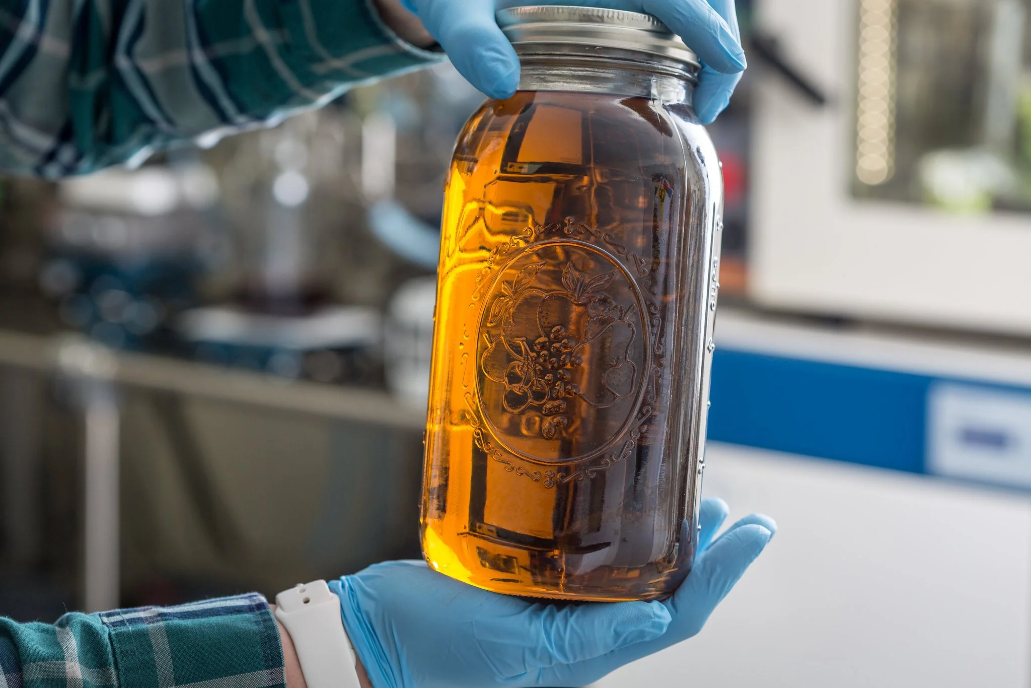 Light brown THC Distillate in a clear jar