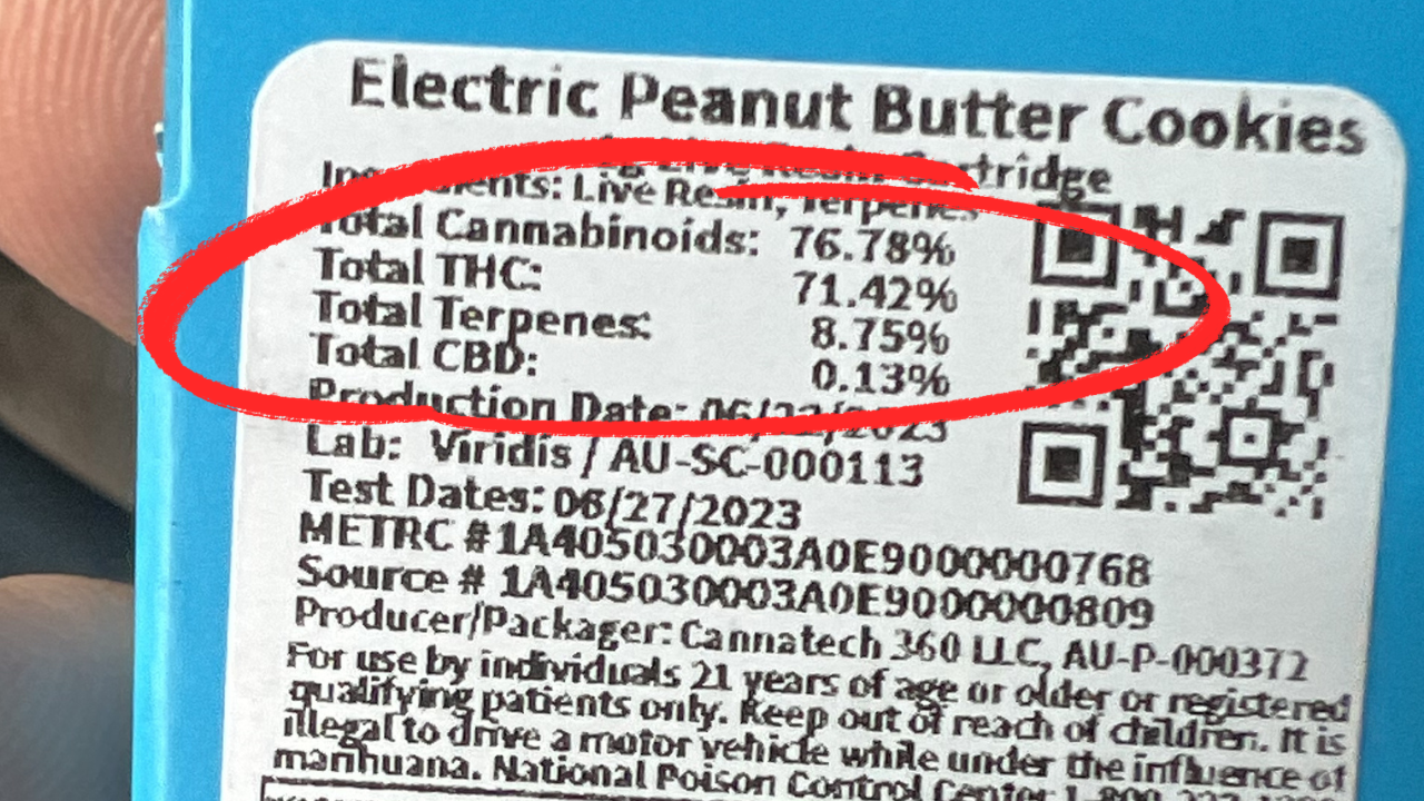 Cannabis vape cartridge label displaying terpene percentages, THC content, and testing information on Michigan packaging.