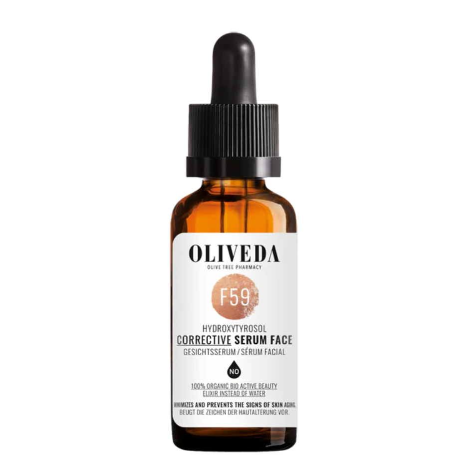 Amber glass bottle with black dropper cap containing face serum, labeled 'Oliveda' with product details for skincare.