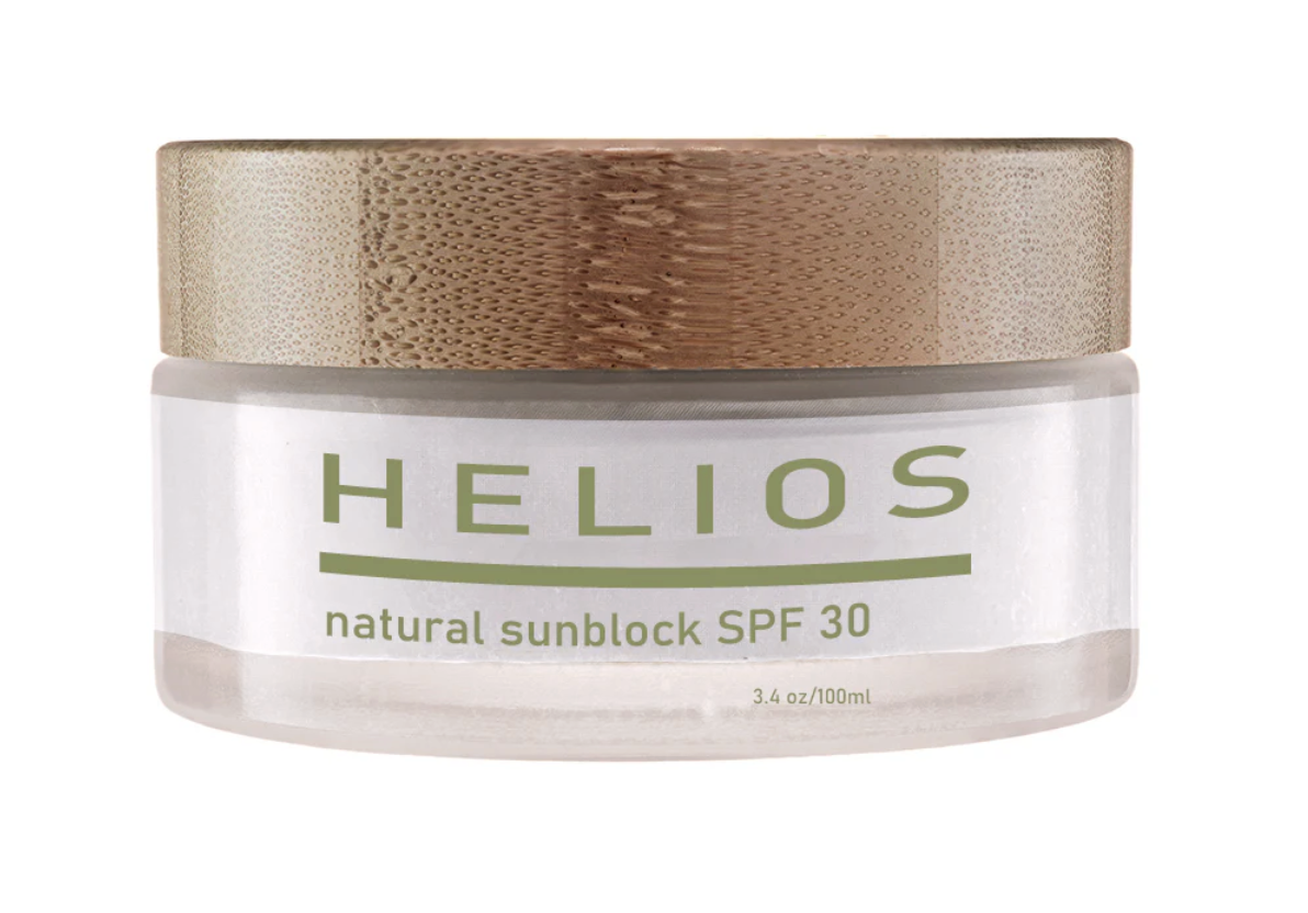 A jar of Helios natural sunblock SPF 30 with a metallic gold lid and a white label.