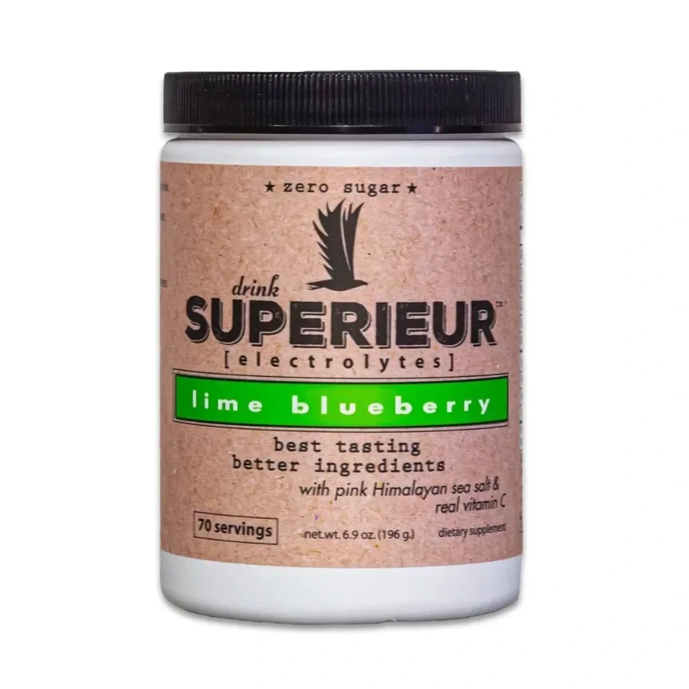 A white container of Superieur electrolyte powder with a black lid, labeled as lime blueberry flavor, zero sugar, with 70 servings, containing pink Himalayan sea salt and vitamin C.