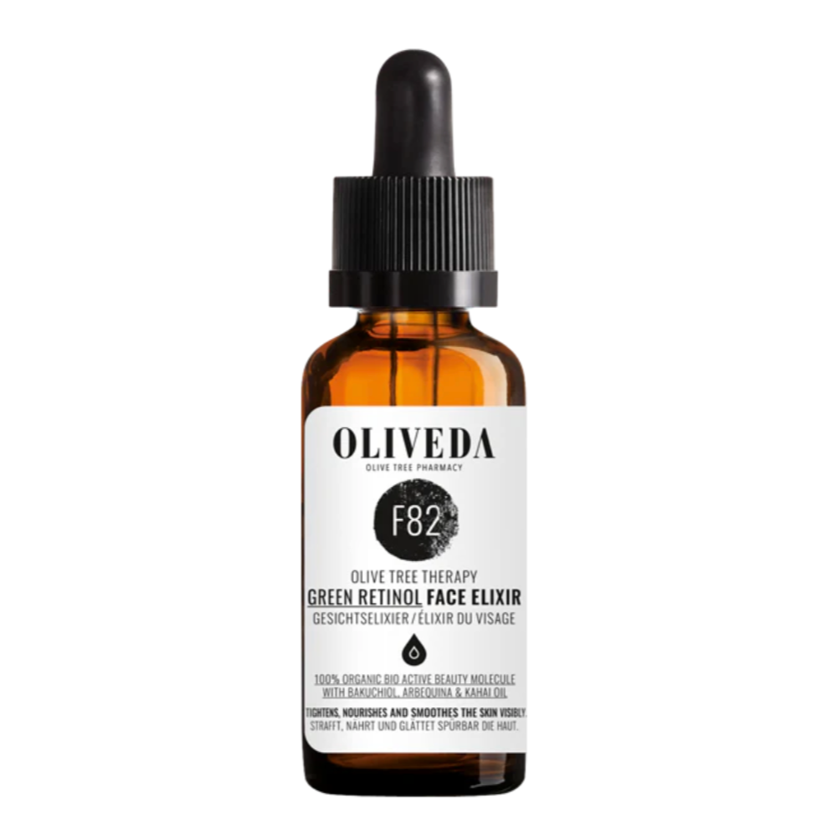 Amber glass bottle with a black dropper cap, labeled 'Oliveda Green Retinol Face Elixir' with black, white, and gray text, promoting natural face skincare.