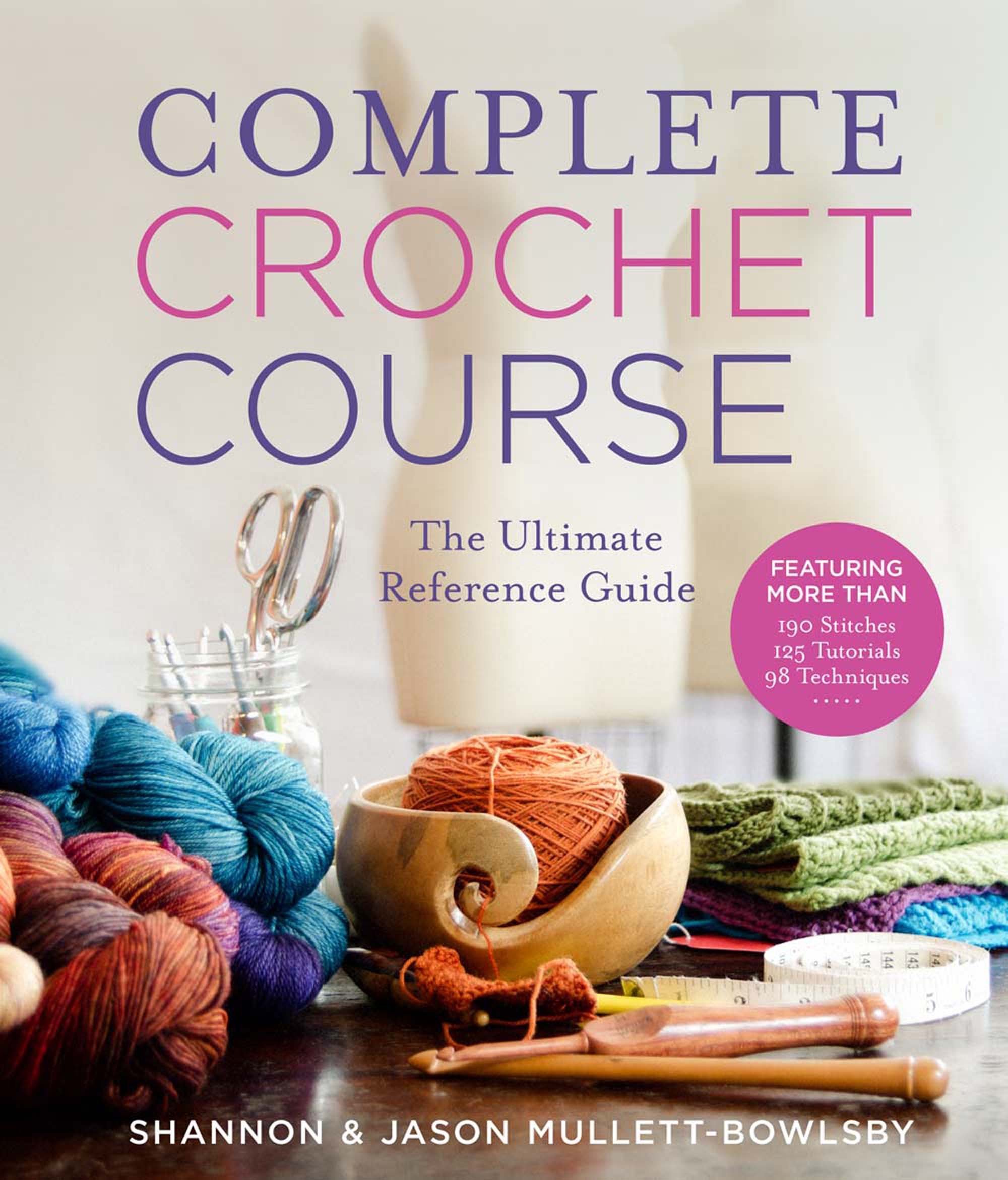 Cover of a crochet book titled 'Complete Crochet Course' featuring balls of colorful yarn, crochet hooks, a measuring tape, and a bowl with yarn on a wooden surface.