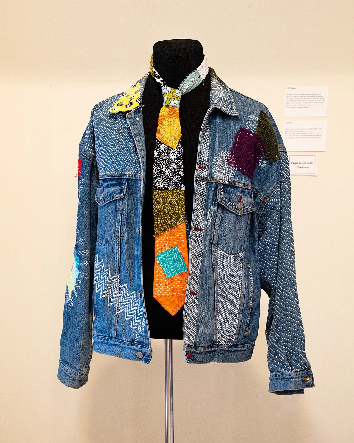 the jacket showing reinforcing stitching and patches 