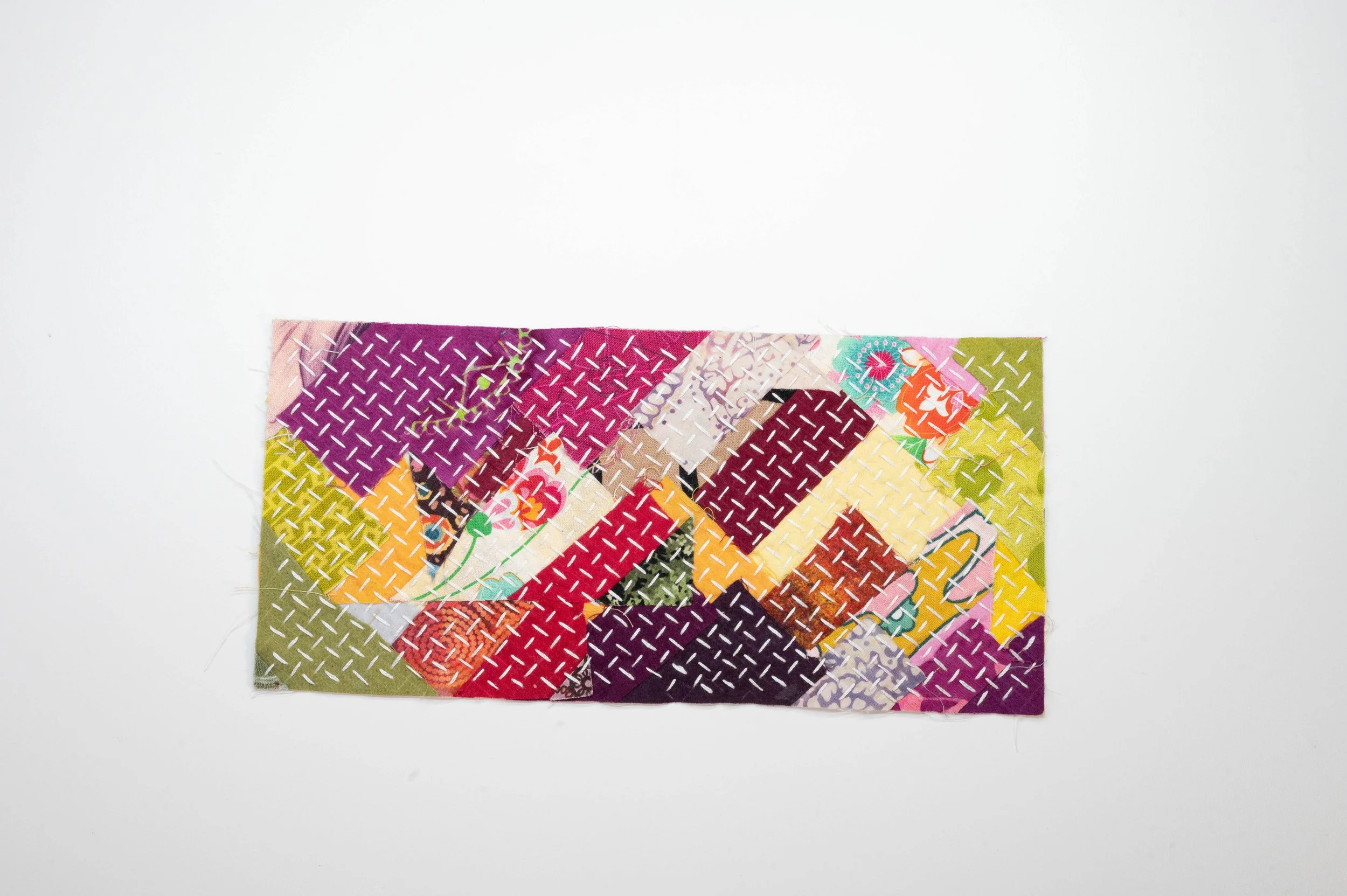 Reclaimed no. 7 • 2025
• Improv pieced reclaimed and hand-dyed fabric, hitomezasii sashiko
• 4 x 7 in.
• Available