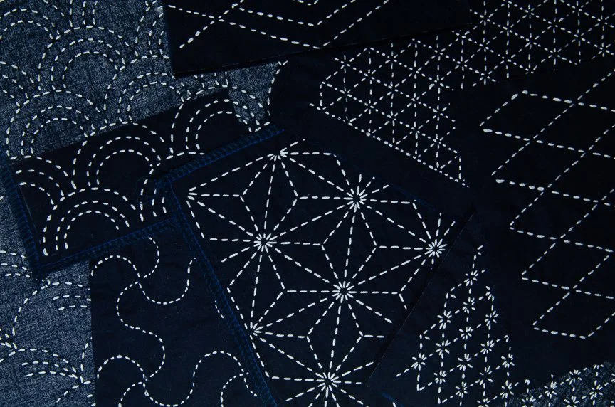 Moyouzashi sashiko stitch patterns on blue fabric