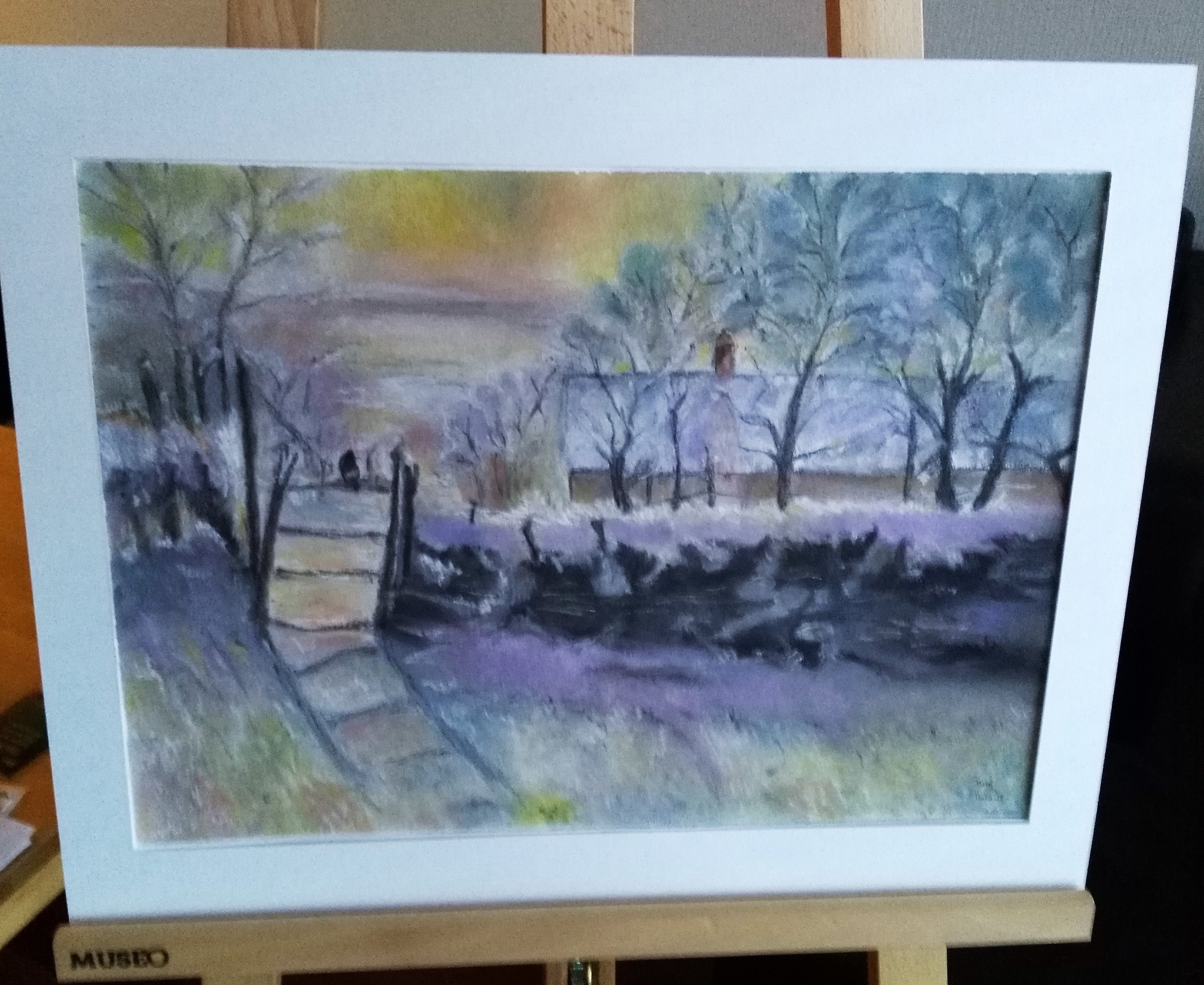 Watercolor painting of a winter landscape with bare trees, a frozen river, and a small bridge, with a colorful sky in the background.