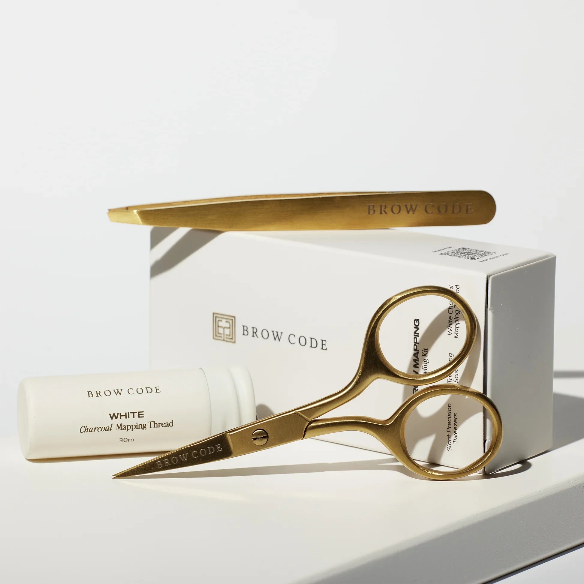 Brow code professional tweezers, show cases the quality equipment used for eyebrow shaping and grooming at Solace Aesthetics