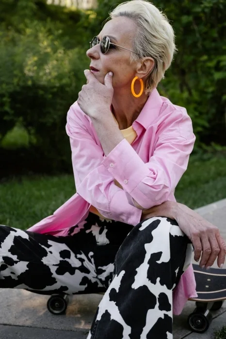 An older women wearing eclectic clothing.