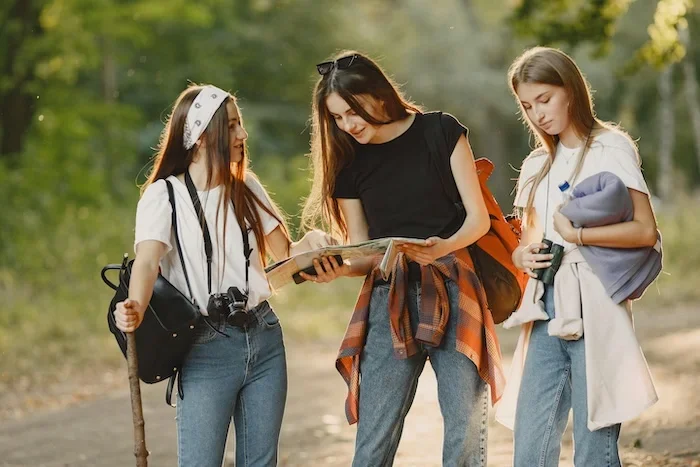 Group of three teen girls outside.