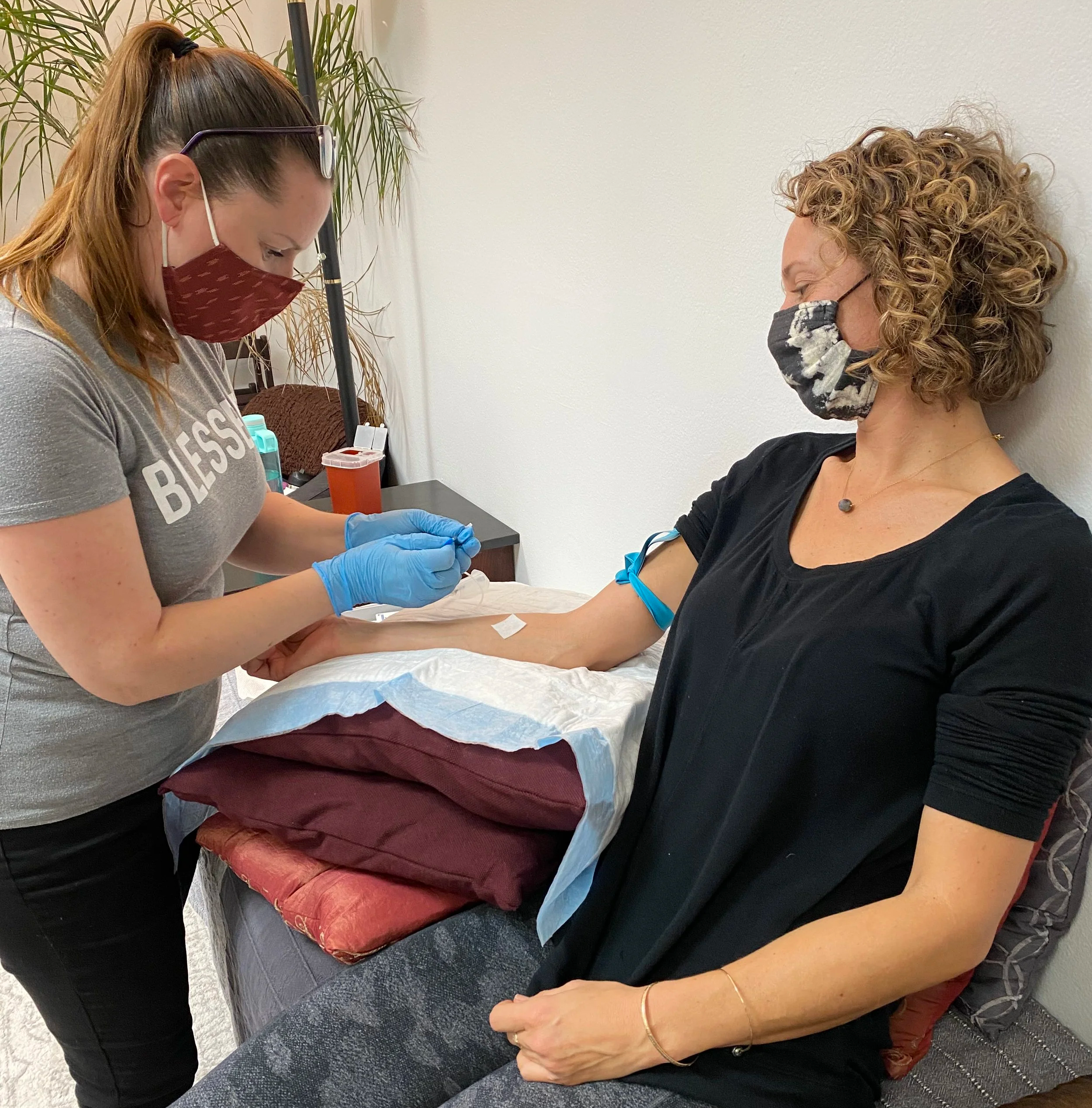 A licensed midwife draws blood for lab work during a well-woman exam in Los Angeles. 