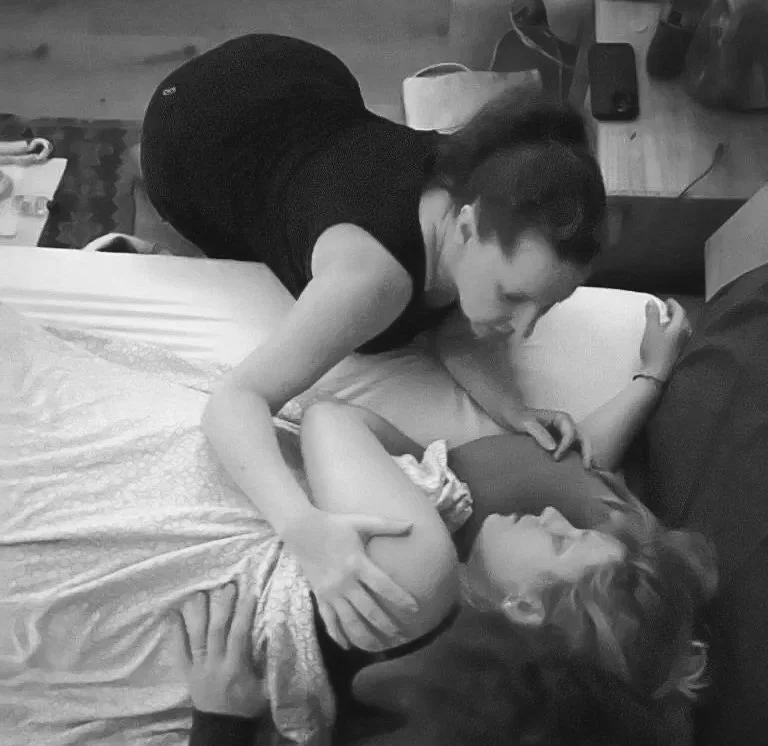A licensed midwife caring for a woman at a home birth in Los Angeles.