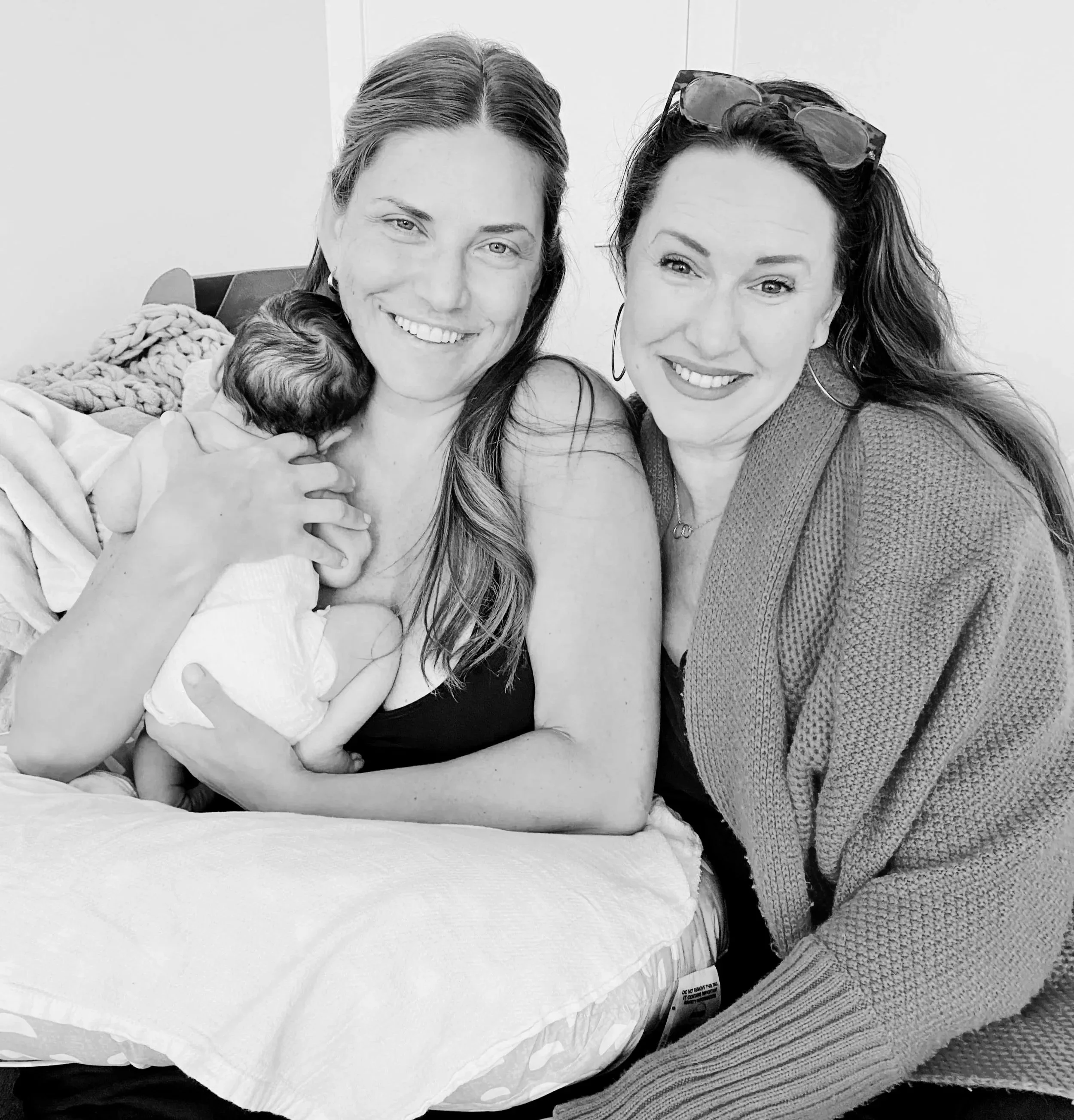 A licensed midwife in los Angeles providing postpartum care at home.