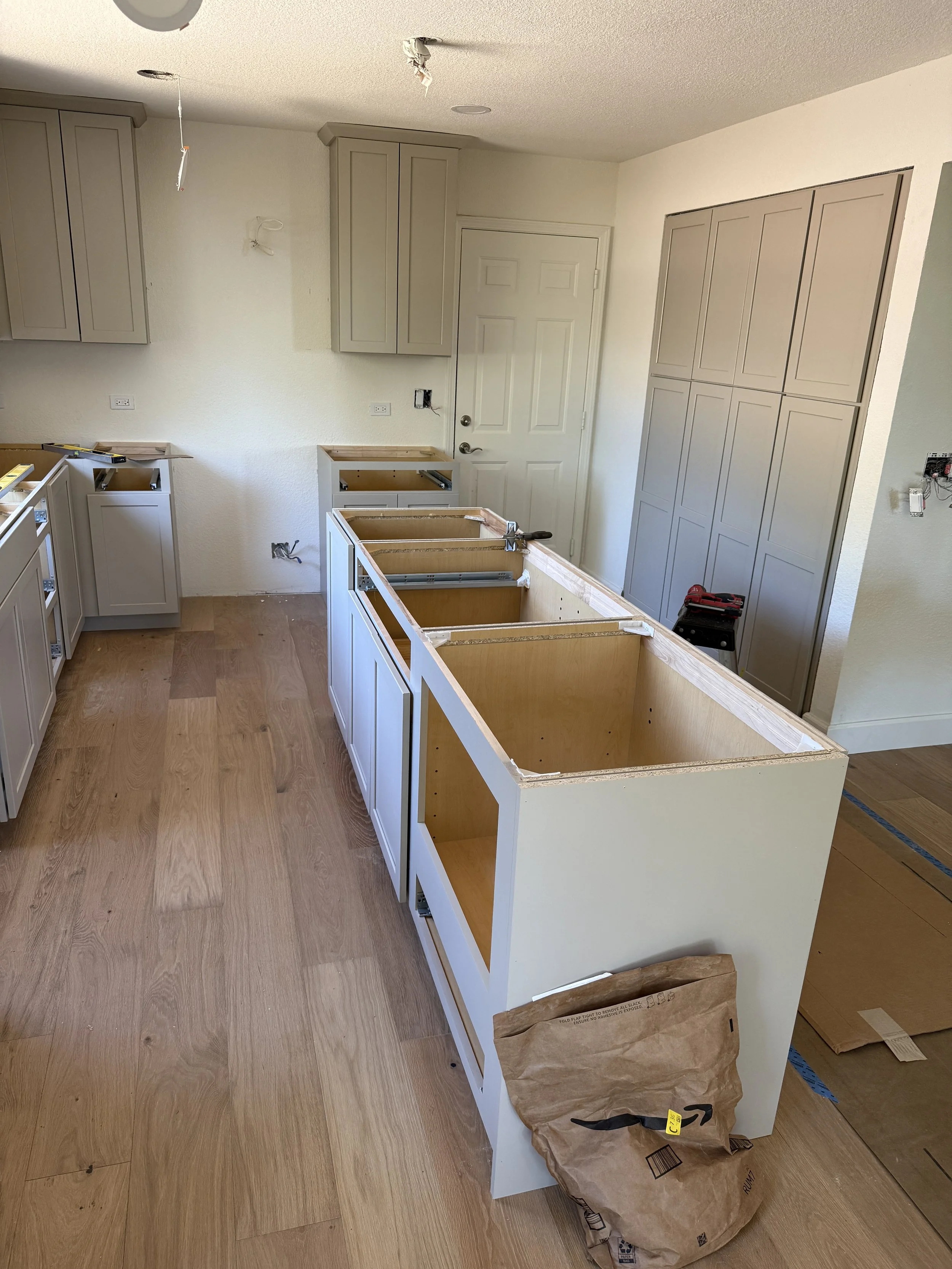 During the install process
Denver Door Style
Painted Oat Color
Shaker Style Island
Kitchen Cabinet Remodel 