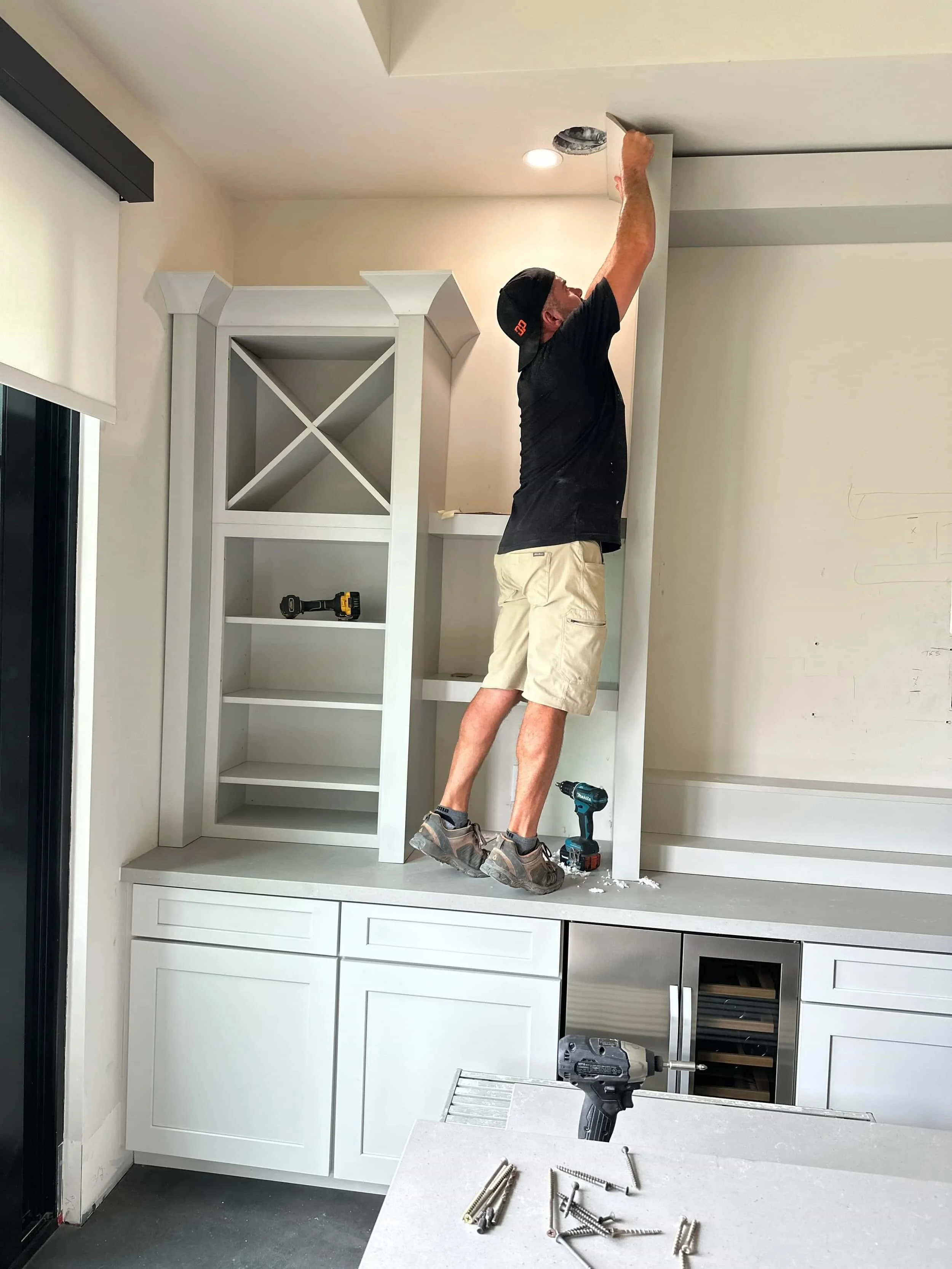 Installing a custom cabinet wine bar sports bar.
Shaker Style Door
Painted Harbor Color
Wine Racks
Boho Cabinet Co