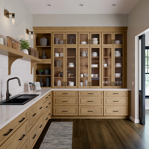 Kitchen with open wooden cabinets full of white and gray dishes, light wood lower cabinets, black sink, white countertop, and dark hardwood floor.