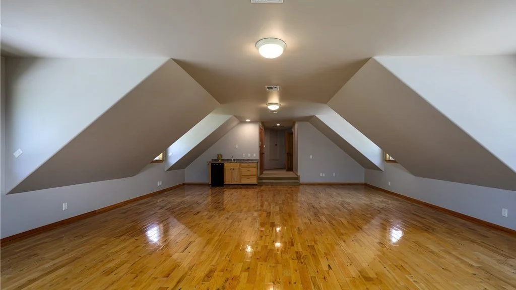 Upstairs room with slanted ceilings are hardwood floors at 5067 E 26th Dr Bellingham WA 98226