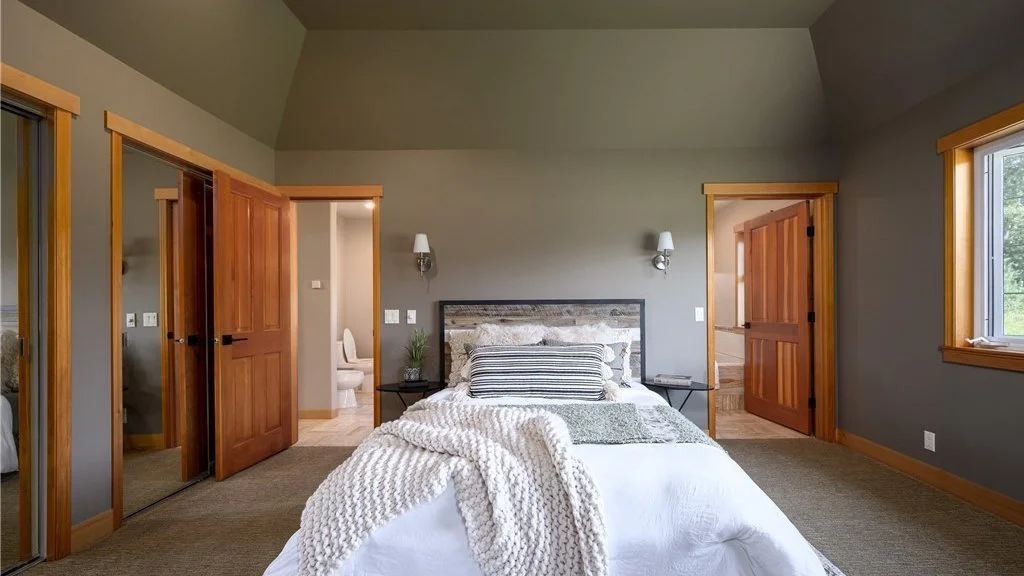 Bedroom with two doors (one on each side of bed) leading to bathroom at 5067 E 26th Dr Bellingham WA 98226