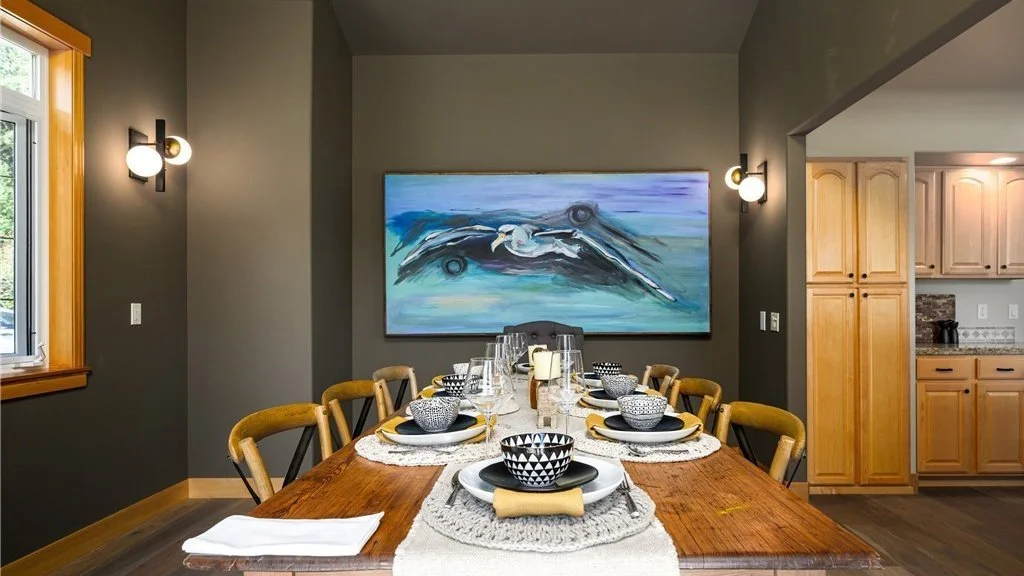 Dining room table with art wall at 5067 E 26th Dr Bellingham WA 98226