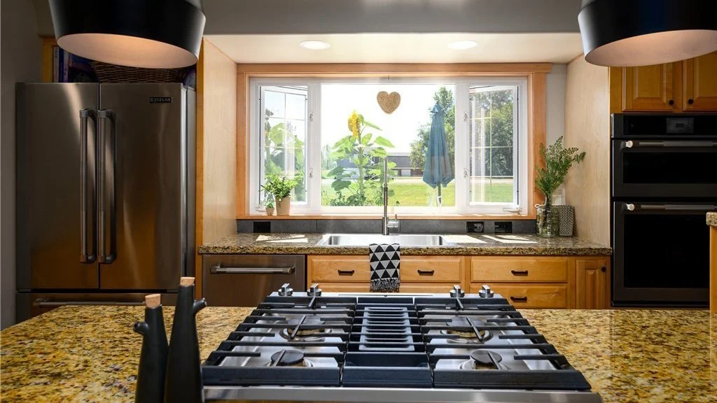 Kitchen island with range top and view of large window at 5067 E 15th Dr Bellingham WA 98226