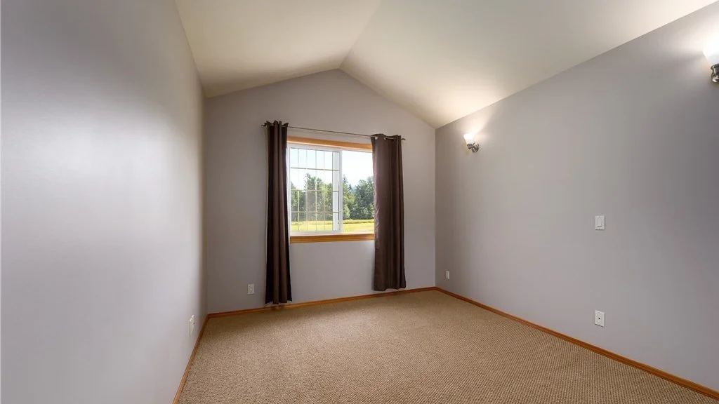 Bedroom with single window and carpeting at 5067 E 26th Dr Bellingham WA 98226