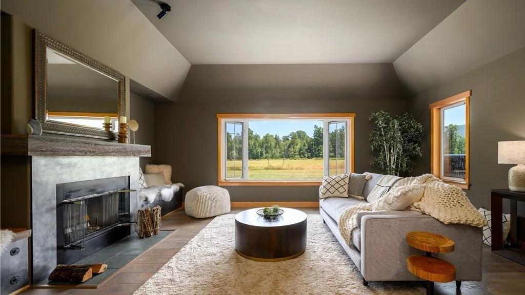 Living room with fireplace and large window at 5067 E 26th Dr Bellingham WA 98226